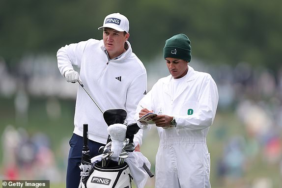 AUGUSTA, GEORGIA - APRIL 11: Matt McCarty of the United States prepares to play his second shot on the first hole alongside caddie Devrath Das during the second round of the 2025 Masters Tournament at Augusta National Golf Club on April 11, 2025 in Augusta, Georgia. (Photo by Andrew Redington/Getty Images)