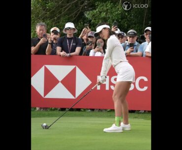 Muni He hits her first tee-shot lightly.