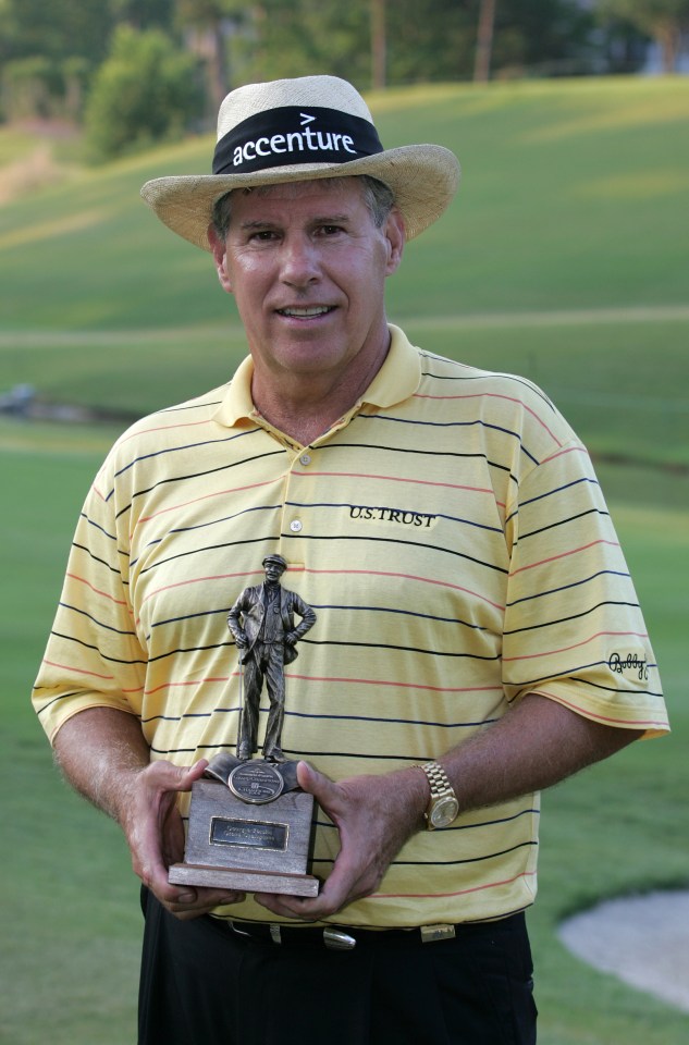 Jay Sigel holding the Georgia-Pacific Grand Champions trophy.