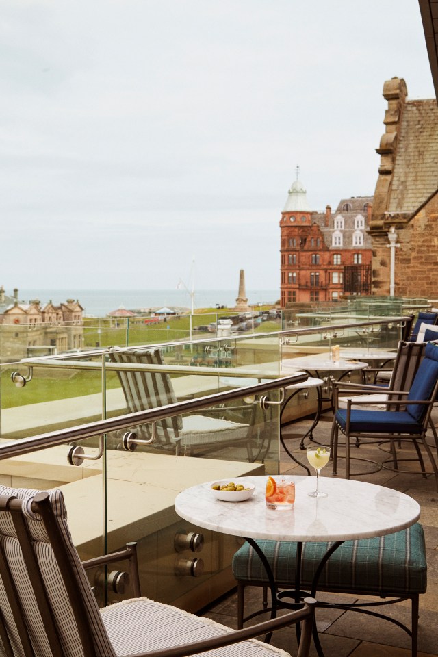 Rooftop restaurant patio with ocean view.