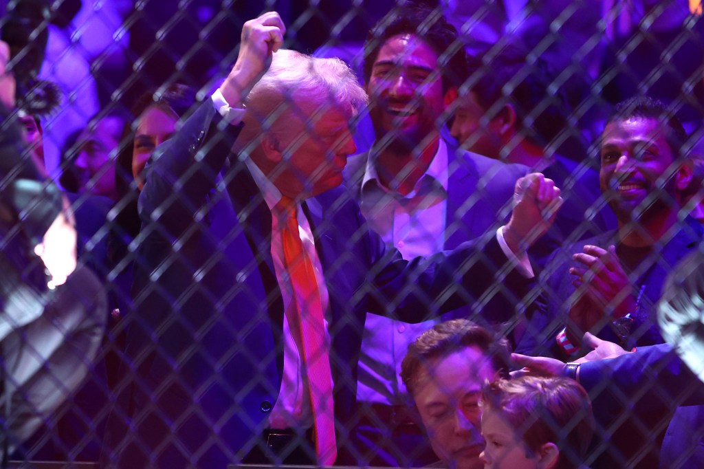 President Donald Trump and Elon Musk attending UFC 314 event, both dressed in suits, in Kaseya Center, Miami