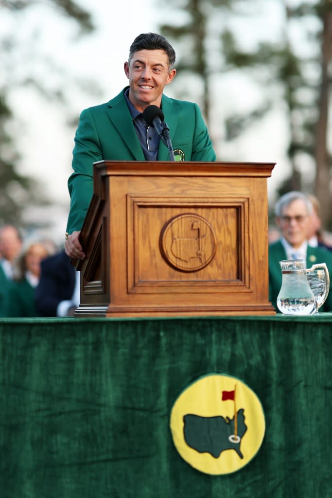 The Irish golfer accepted his first Masters trophy while his spouse watched from the crowd. Getty Images