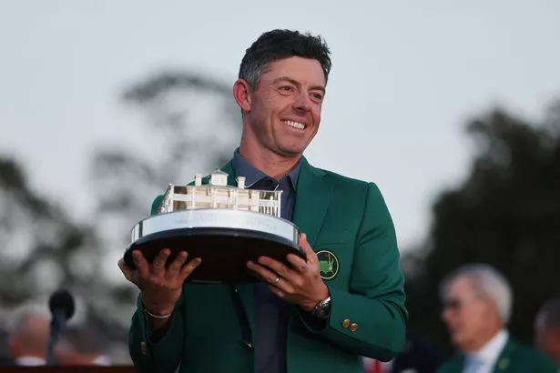 Rory McIlroy poses with the Masters trophy