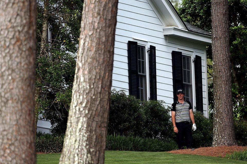 Rory McIlroy waits on the tenth hole after an errant tee shot during the final round of the 2011 Masters Tournament at Augusta National Golf Club.  (Photo by Andrew Redington/Getty Images)