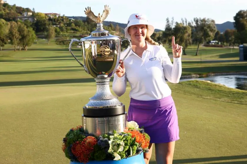 Ingrid Lindblad poses with the trophy after winning the LPGA JM Eagle LA Championship golf tournament at El Caballero Country Club, Sunday, April 20, 2025, in Los Angeles. (AP Photo/Jessie Alcheh)
