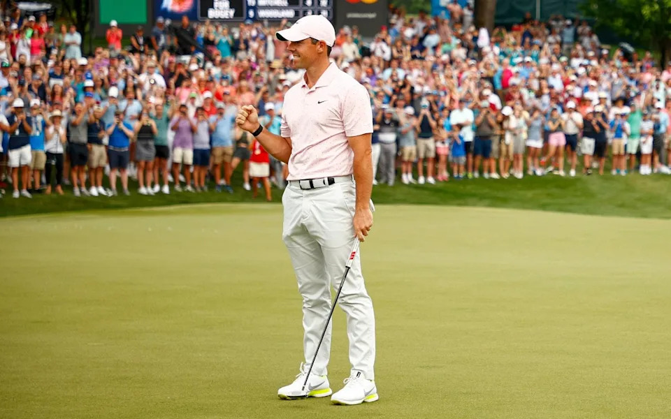 Rory McIlroy of Northern Ireland celebrates winning on the 18th green during the final round of the 2021 Wells Fargo Championship at Quail Hollow Club on May 09, 2021 in Charlotte, North Carolina