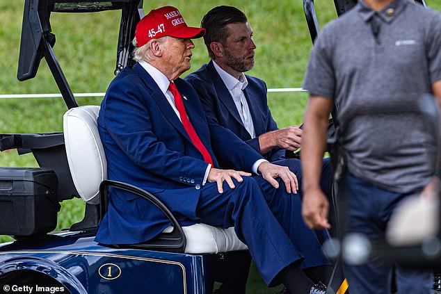 President Donald Trump and his son Eric, are seen on the ninth hole during previews for LIV Golf Miami at Trump National Doral Miami in Doral, Florida