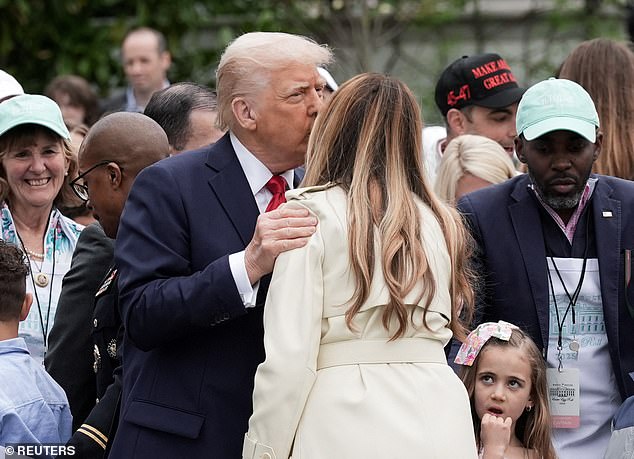 President Donald Trump smooched his wife, first lady Melania Trump, on the South Lawn during Monday's White House Easter Egg Roll