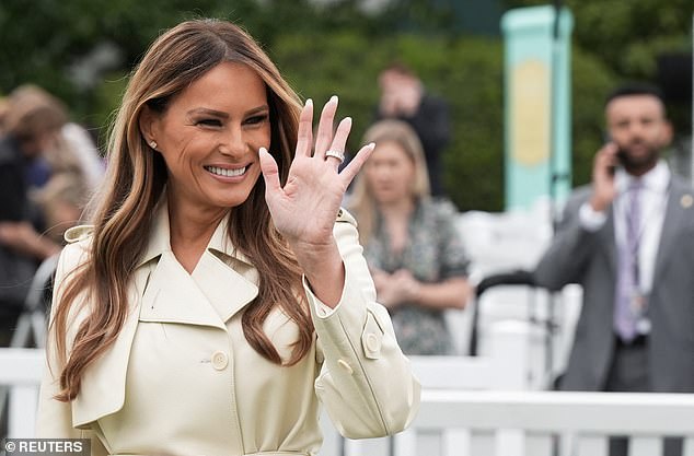 First lady Melania Trump waves during the annual White House Easter Egg Roll on Monday
