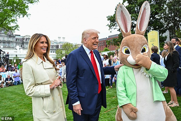 First Lady Melania Trump and President Donald Trump are joined by a person dressed as the Easter Bunny