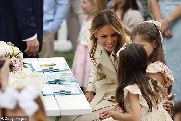 Melania Trump talks to children at the coloring tables