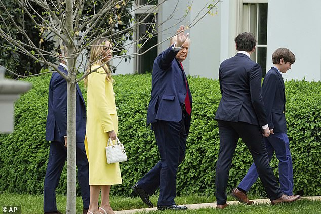 President Donald Trump, followed by Donald Trump Jr., and his girlfriend Bettina Anderson, and two great grandsons walks to the Oval Office
