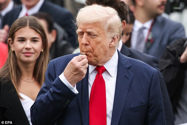 Kai Trump watches her grandfather start the egg roll race