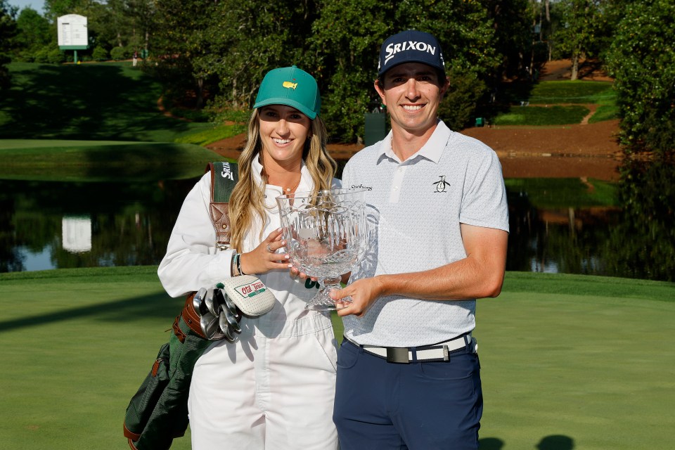 AUGUSTA, GEORGIA - APRIL 09: Nicolas Echavarria of Colombia<br />
poses with his girlfriend and caddie, Claudia De Antonio, alongside the Par Three Contest trophy following victory in the Par Three Contest prior to the 2025 Masters Tournament at Augusta National Golf Club on April 09, 2025 in Augusta, Georgia. (Photo by Harry How/Getty Images)