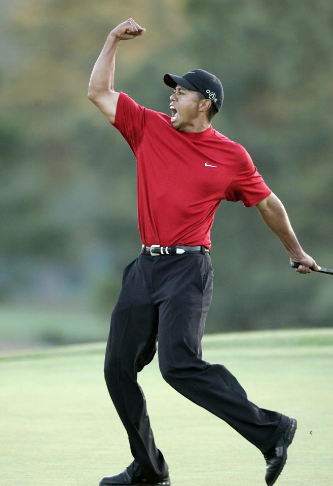 AUGUSTA, UNITED STATES: US golfer Tiger Woods celebrates after making the winning putt 10 April 2005 during the final round of the 2005 Masters Golf Tournament at the Augusta National Golf Club in Augusta, Georgia. Woods beat fellow American Chris DiMarco in a one-hole playoff. AFP PHOTO/Jeff HAYNES (Photo credit should read JEFF HAYNES/AFP via Getty Images)