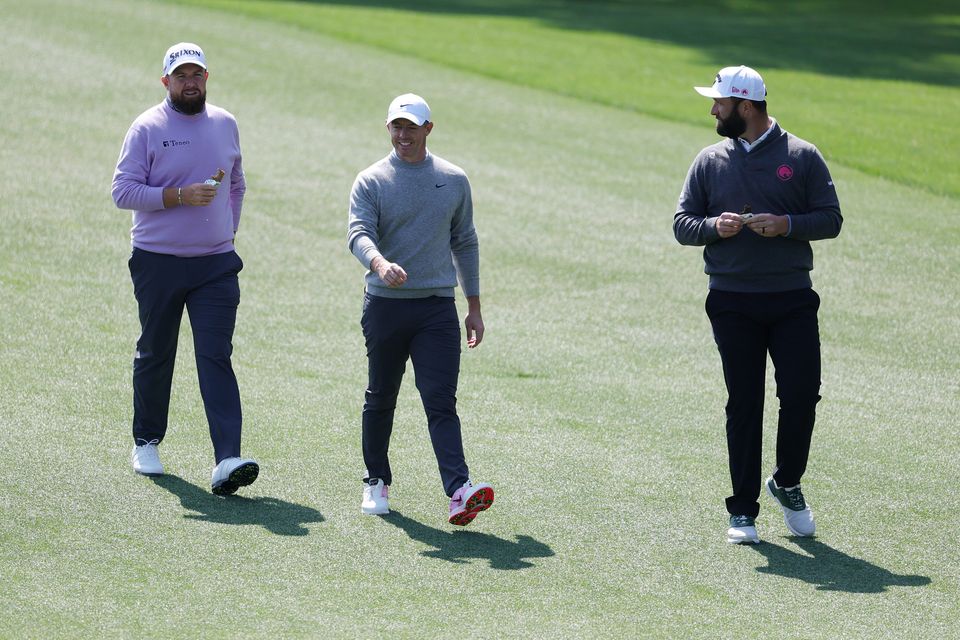 Shane Lowry, Rory McIlroy and Jon Rahm walk on the third hole during yesterday's practice round. Photo: Getty