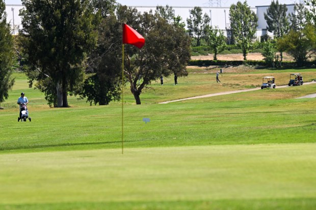 Golfers play on El Prado Golf Course on Tuesday, April...
