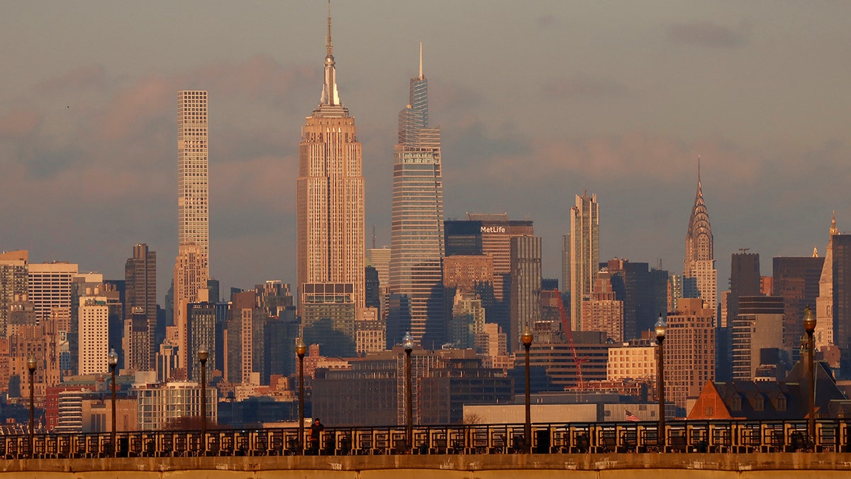 The sun sets on 432 Park Avenue, the Empire State building, One Vanderbilt and the Chrysler Building on the midtown Manhattan skyline on Jan. 25, 2022, in New York City.