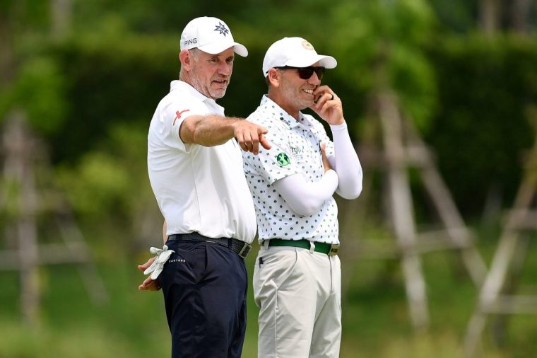 PATHUM THANI, THAILAND - MARCH 01: Team England captain Lee Westwood (L) and Team World captain Sergio Garcia (R) speak on the 10th green during the Reignwood Icons of Football Golf Tournament at Robinswood Golf Club on March 01, 2025 in Pathum Thani, Thailand. (Photo by Apinya Rittipo/Getty Images)
