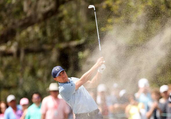 Jordan Spieth plays a shot plays a shot