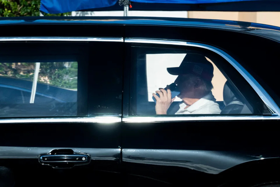 US President Donald Trump leaves the Mar-a-Lago resort in Palm Beach, Florida on his way to play golf with Tiger Woods at his International Golf Club in West Palm Beach on February 9, 2025.
