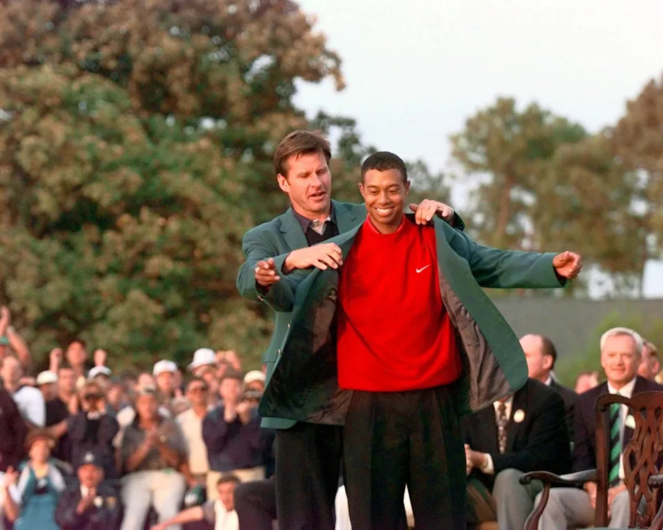 Tiger Woods gets his green jacket from 1996 champ Nick Faldo after winning the 61st Masters Tournament in 1997 at Augusta National Golf Club. (Photo: Porter Binks/USA TODAY)