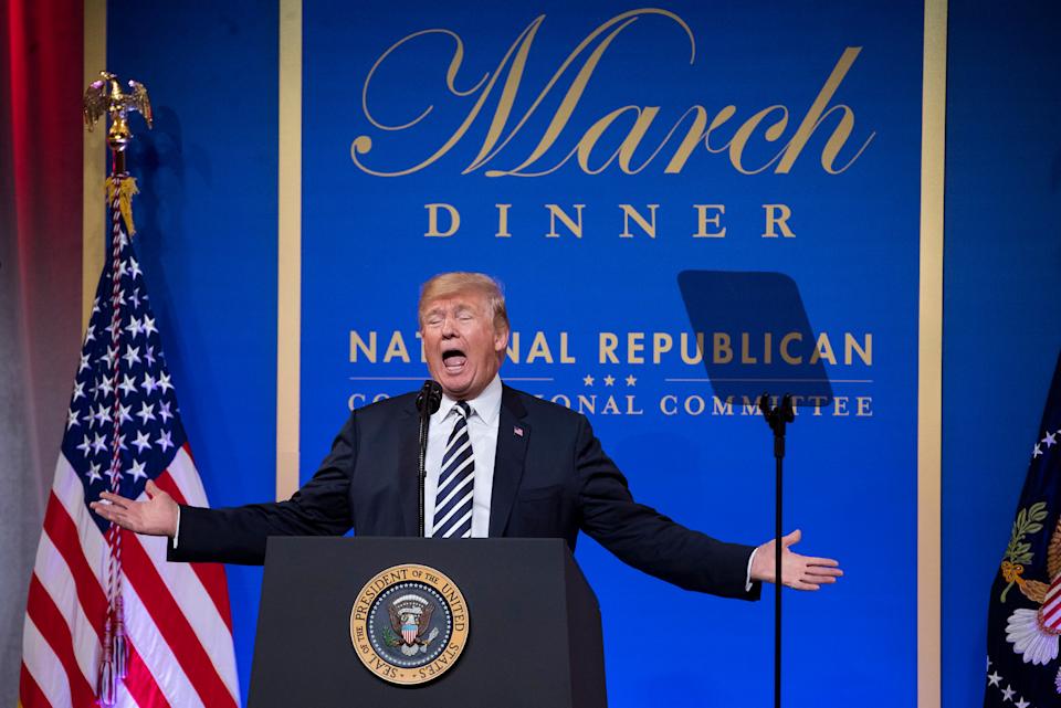 A person stands at a podium with presidential seal, speaking at the National Republican Congressional Committee March Dinner