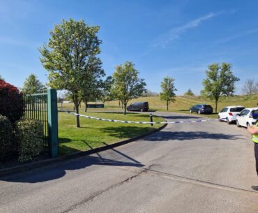 Police at the entrance to Aston Wood Golf Club