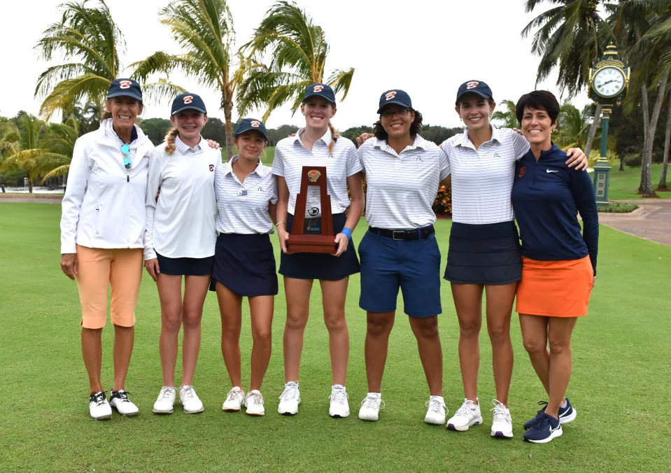 The Benjamin girls golf squad poses for a photo after winning the district title trophy at Trump International (Oct. 28, 2024).
