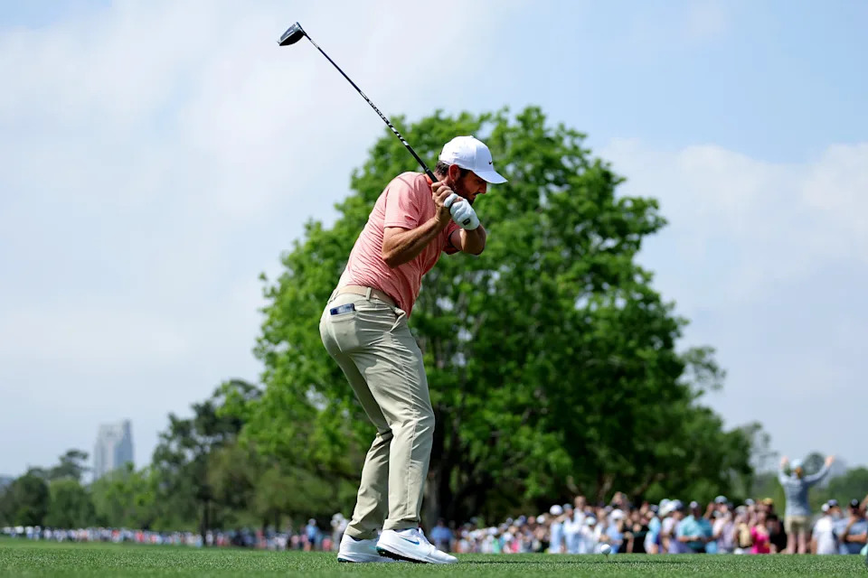 Mar 29, 2025; Houston, Texas, USA; Scottie Scheffler hits a tee shot on the first hole during the third round of the Texas Children's Houston Open golf tournament. Mandatory Credit: Erik Williams-Imagn Images