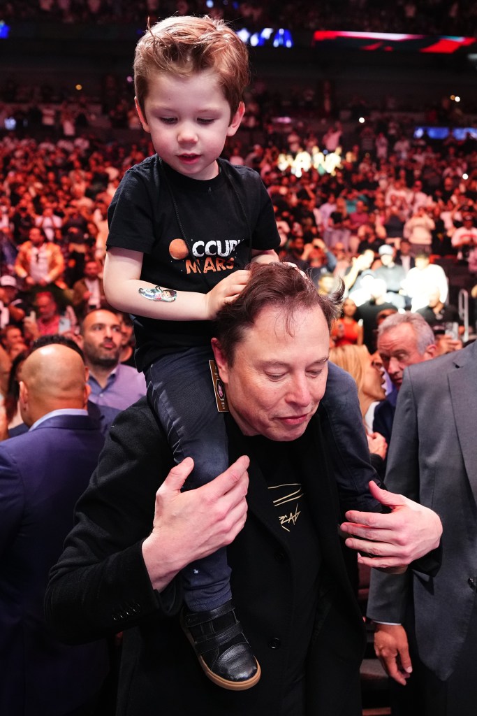 Elon Musk carrying his son X Æ A-Xii on his shoulders at the UFC 314 event in Miami, Florida