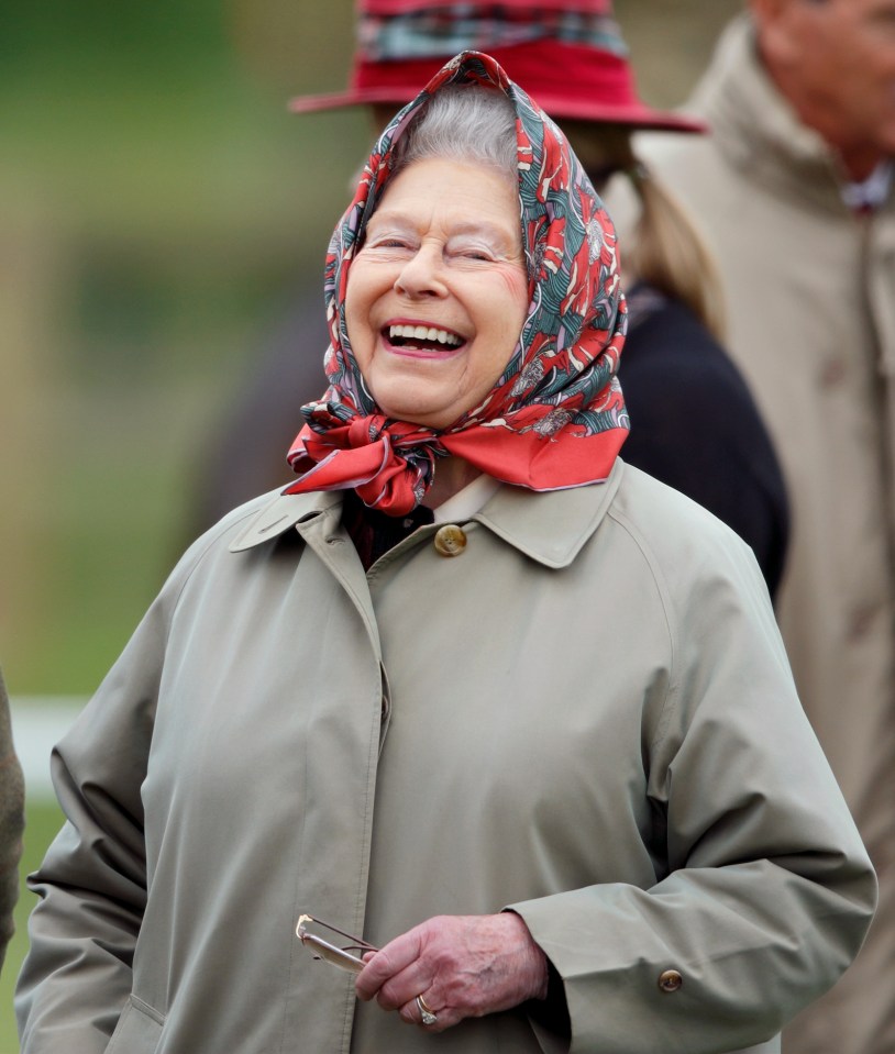 Queen Elizabeth II smiling at the Royal Windsor Horse Show.