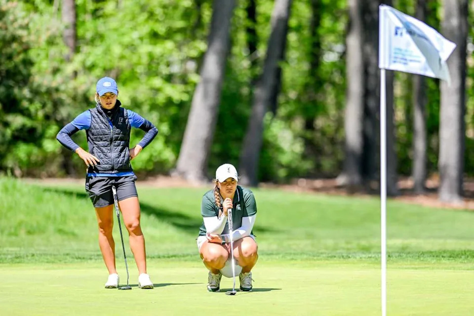Michigan State's Paula Balanzategui, right, reads the green before putting on the 8th hole during the final round of the NCAA women's golf regional on Wednesday, May 8, 2024, at Forest Akers West Golf... Nick King&sol;Lansing State Journal-USA TODAY NETWORK