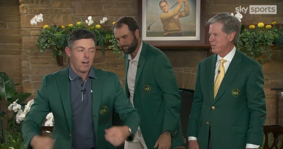 Scottie Scheffler, Rory McIlroy, and another man in green jackets.