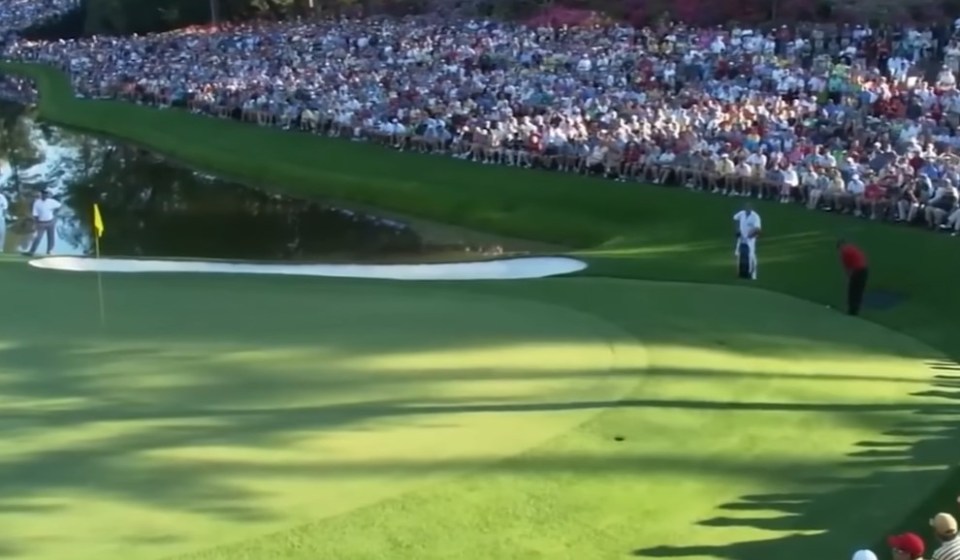 Woods stared at a long distance before settling in for his putt