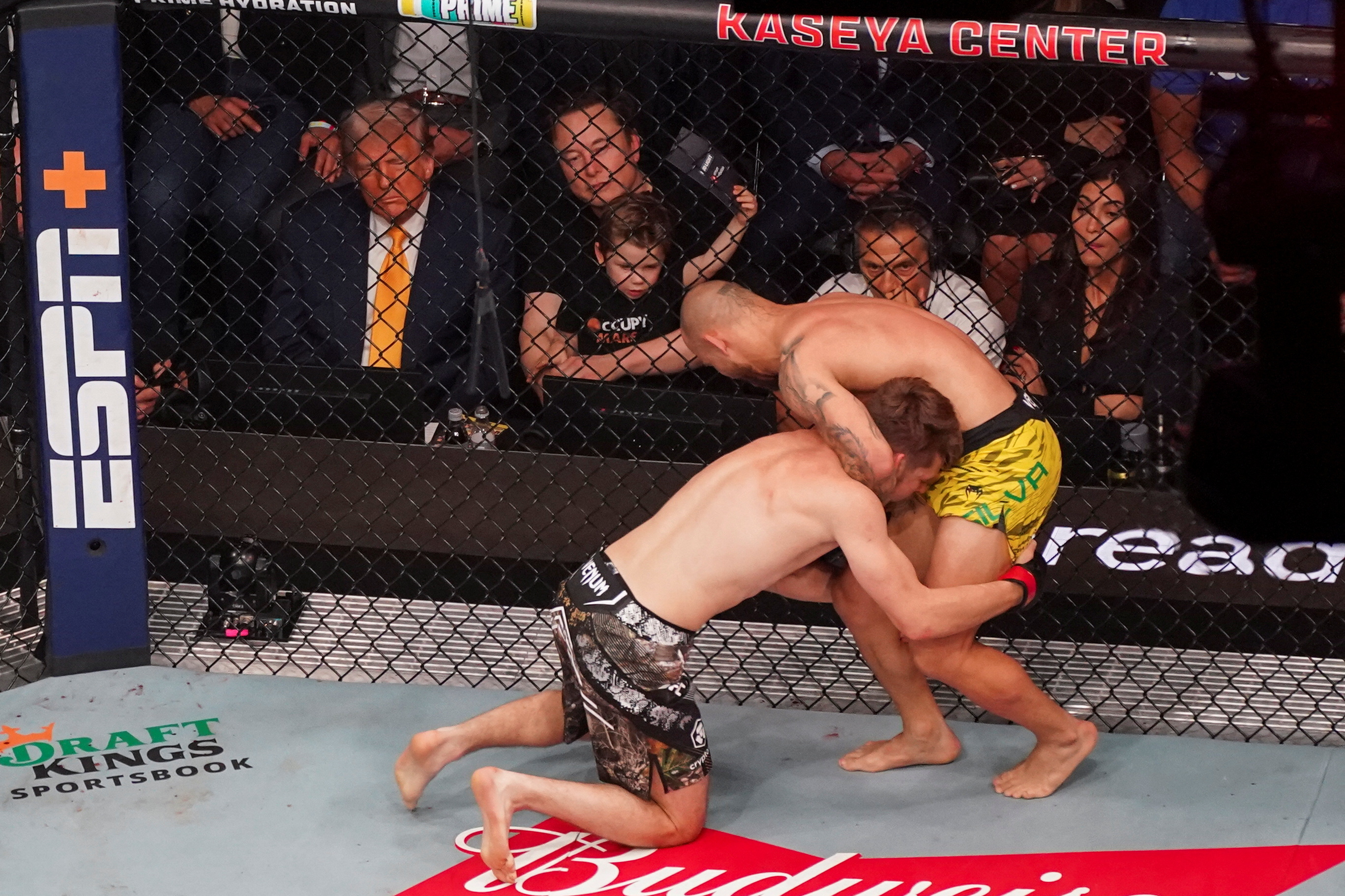 U.S. President Donald Trump and Elon Musk watching a UFC match between Bryce Mitchell and Jean Silva in Miami, Florida.