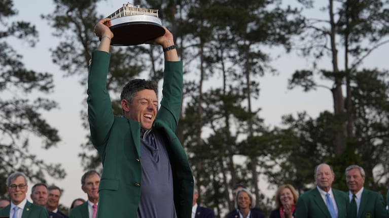 Winner Rory McIlroy, of Northern Ireland, holds the trophy at the Masters golf tournament, Sunday, April 13, 2025, in Augusta, Ga.