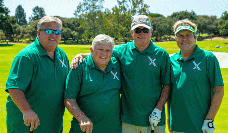 Wearing kelly green polo shirts are James Hall and James Hall Jr. with friends at the 2024 tournament. (Courtesy photo)