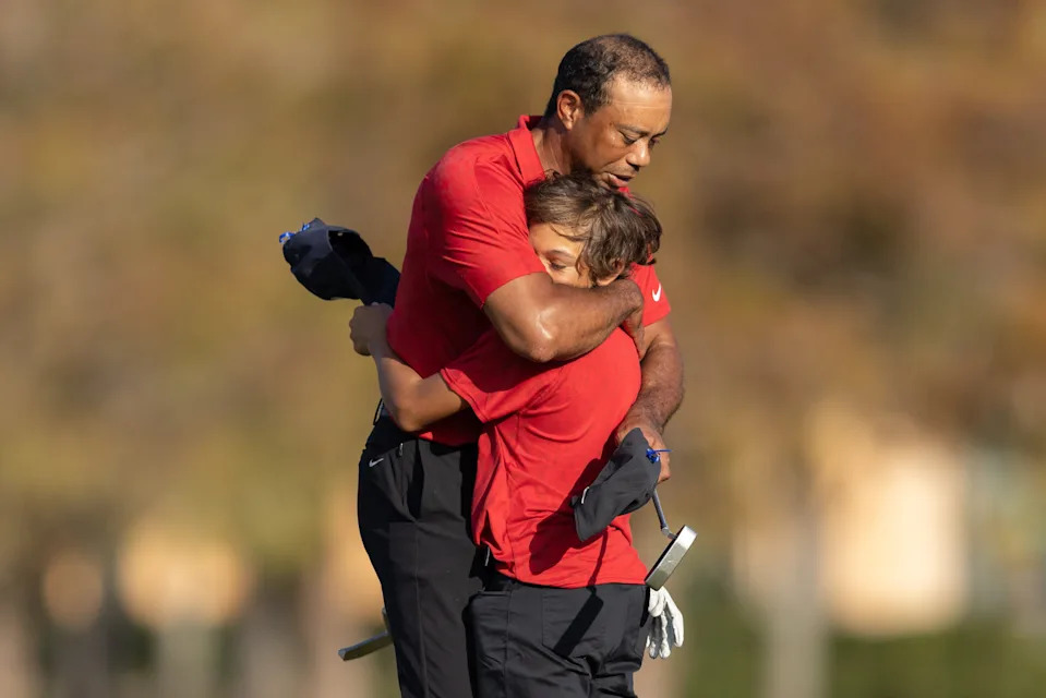Tiger Woods hugs his son, Charlie, after the final round of the PNC Championship in Orlando two weeks ago.