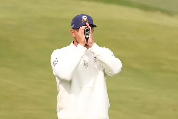 Bryson DeChambeau using a rangefinder device at LIV Golf's event in South Korea