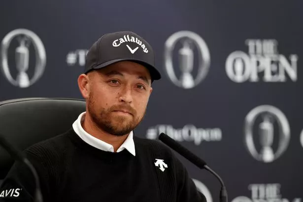 TROON, SCOTLAND - JULY 16: Xander Schauffele of the United States talks to the media during a press conference prior to The 152nd Open championship at Royal Troon on July 16, 2024 in Troon, Scotland. (Photo by Kevin C. Cox/Getty Images)