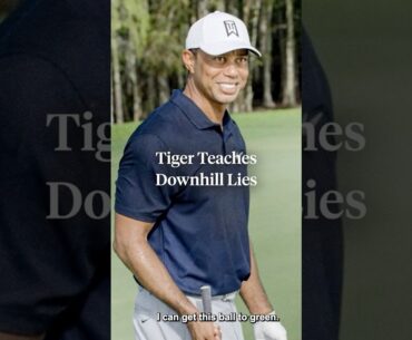 Tiger Woods demonstrates how to keep your balance on a downhill lie. ⚖️