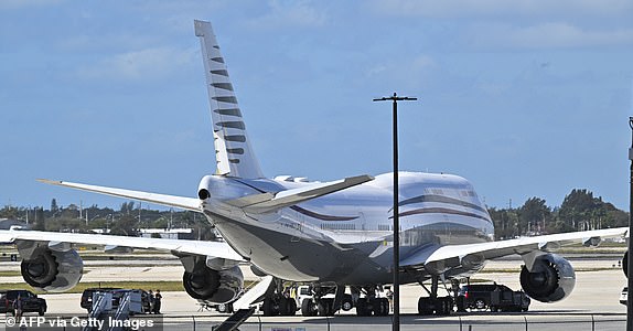 The Qatari-plane which Trump toured in February 2025 while  at Palm Beach International Airport  /  The motorcade of US President Donald Trump is parked next to an almost 13-year-old Boeing 747 sitting on the tarmac at Palm Beach International Airport in West Palm Beach, Florida. on February 15, 2025. Trump, who toured the plane, is reported to be frustrated by delays to two new presidential planes which were reported to be delivered in 2026 and 2027, but now may not be ready until 2029 or possibly later. (Photo by ROBERTO SCHMIDT / AFP) (Photo by ROBERTO SCHMIDT/AFP via Getty Images)