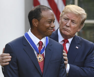 US President Donald Trump presents US golfer