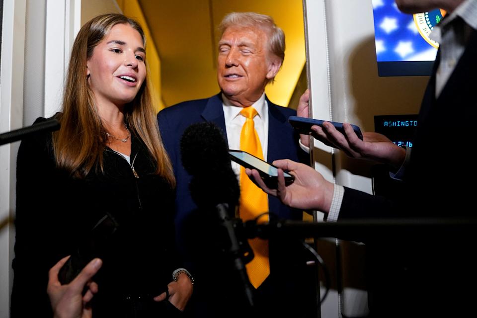 U.S. President Donald Trump's granddaughter Kai Madison Trump speaks to the media on board Air Force One on the way to West Palm Beach, Florida, U.S., April 13, 2025. REUTERS/Nathan Howard