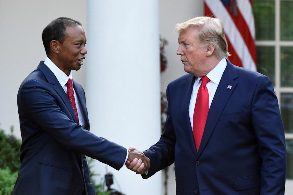 Woods (seen here with the president in 2019) has known Donald for years. REUTERS