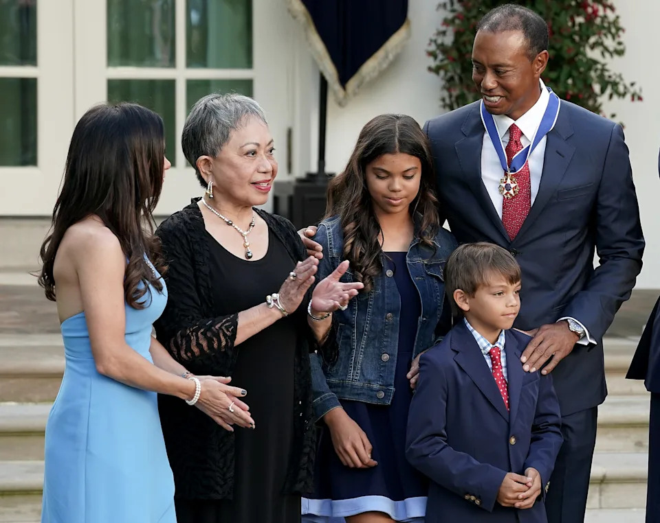 WASHINGTON, DC - MAY 06: Professional golfer Tiger Woods (R) is joined by his mother Kultida Woods (2nd L), children Sam Alexis Woods and Charlie Axel Woods and girlfriend Erica Herman during his Medal of Freedom ceremony in the Rose Garden at the White House May 06, 2019 in Washington, DC. President Donald Trump announced he would give the nation’s highest civilian honor to business partner Woods, 43, in honor of his Masters victory last month. (Photo by Chip Somodevilla/Getty Images)