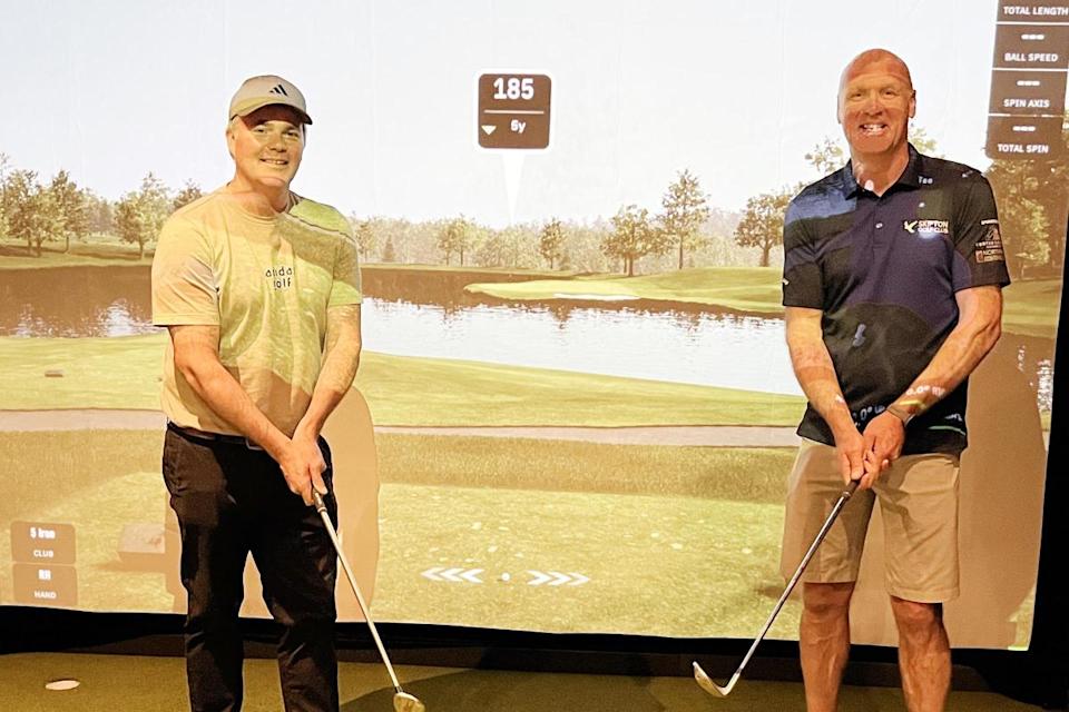 PGA professional Ben Mallinson is pictured left in the upgraded Skipton Swing Studio with club member Stephen Tosney. The course in the background is famous Quail Hollow in North Carolina, USA, and one of its signature par 3 holes. Image: Robin Moule