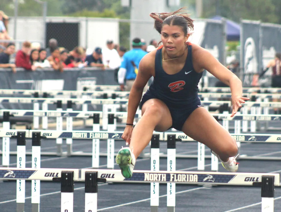 Sam Woods of Benjamin clears a hurdle in the girls 100-meter hurdles during the FHSAA Class 1A high school track and field championships on May 10, 2025. [Clayton Freeman/Florida Times-Union]