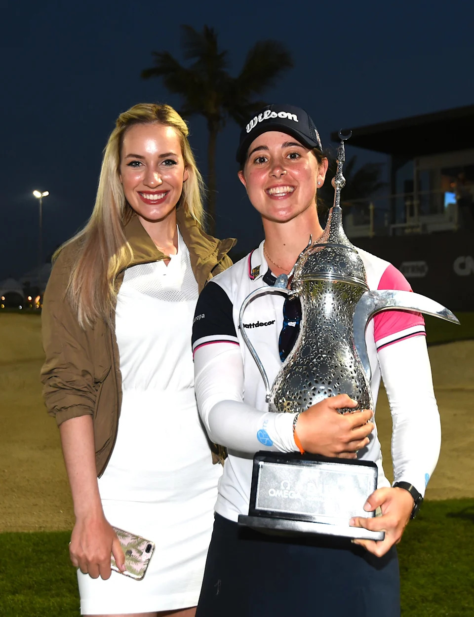 Winner Nuria Iturrios of Spain and Paige Spiranac of United States pose with the trophy during the Omega Dubai Moonlight Classic on Day Three at Emirates Golf Club on May 03, 2019 in Dubai, United Arab Emirates.